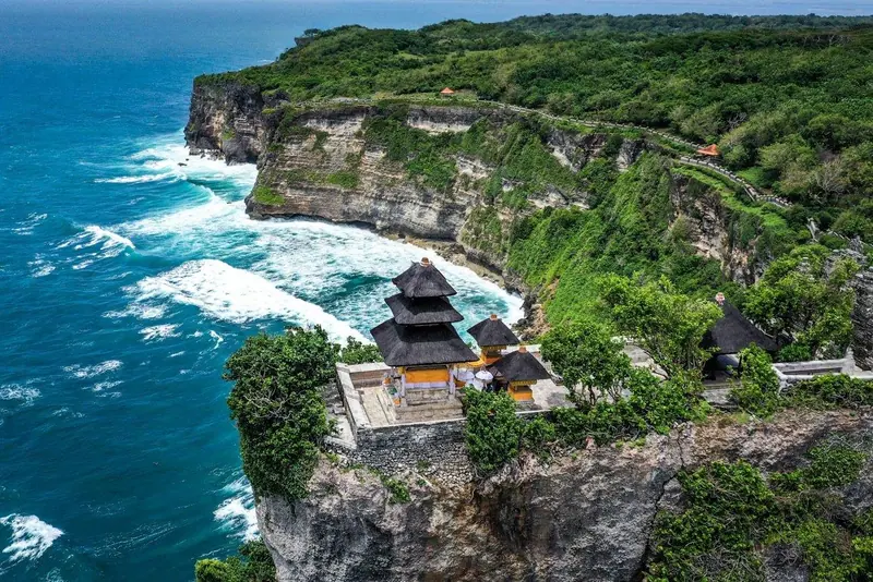 Uluwatu Temple on the cliffs above the ocean in Bali